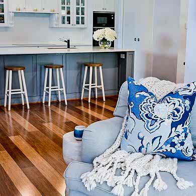 Hamptons Kitchen in Timeless Grey by Dulux, with pendant lighting, Provincial Home Living Occasional Chair with Meissen Ink Cushion and Throw from Bed Bath and Table, Verdura Timber Flooring from Australiana Style Group