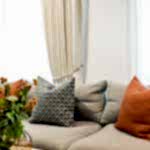 Custom Curtains by MotzDesigns in Nova Natural and Custom Cushions by MotzDesigns In Chivasso fabric with Accent Cushion in Lempika Delaunay fabric Lounge from Loungelovers and accessories from Pillow Talk